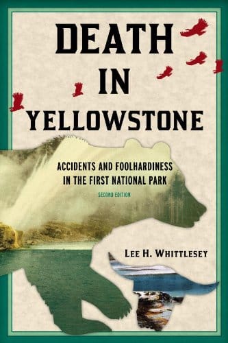 Cover of the book 'Death in Yellowstone: Accidents and Foolhardiness in the First National Park, Second Edition' by Lee H. Whittlesey. The design features a map of Yellowstone with a geyser illustration and red animal footprints across the top.