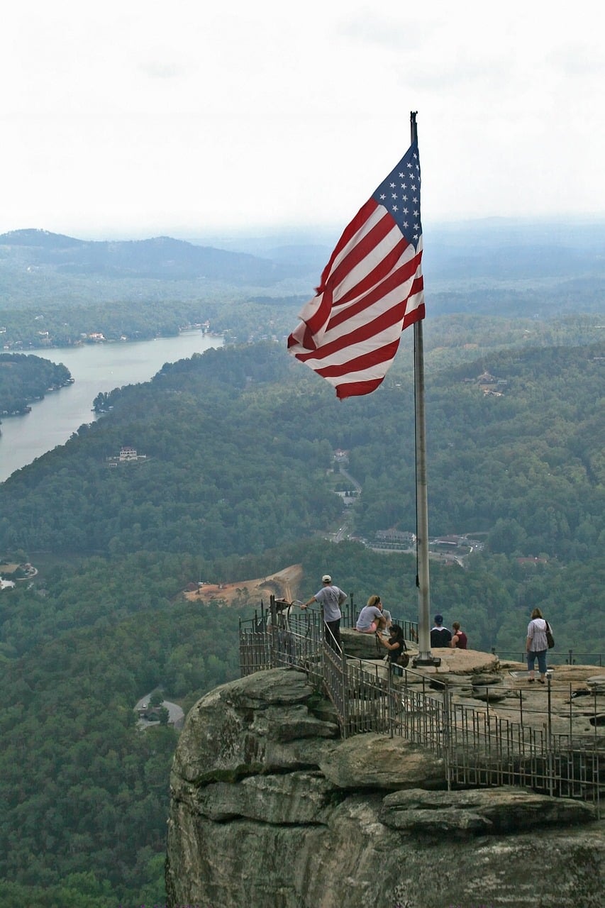 A US flag on a rocky outcropping