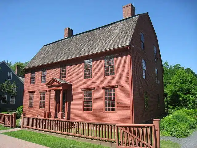 A red plank two-story building.