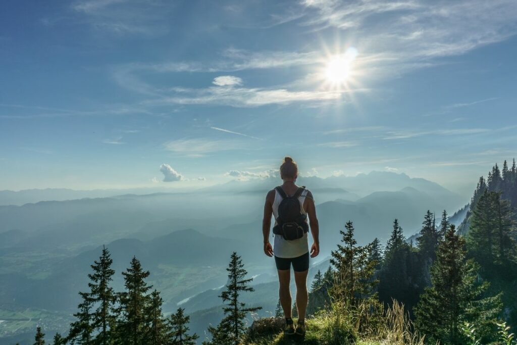 Someone standing with their back to the camera enjoying the view.  