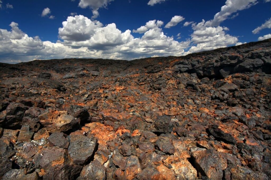 Black and orange colored rocks as far as the eye can see. 