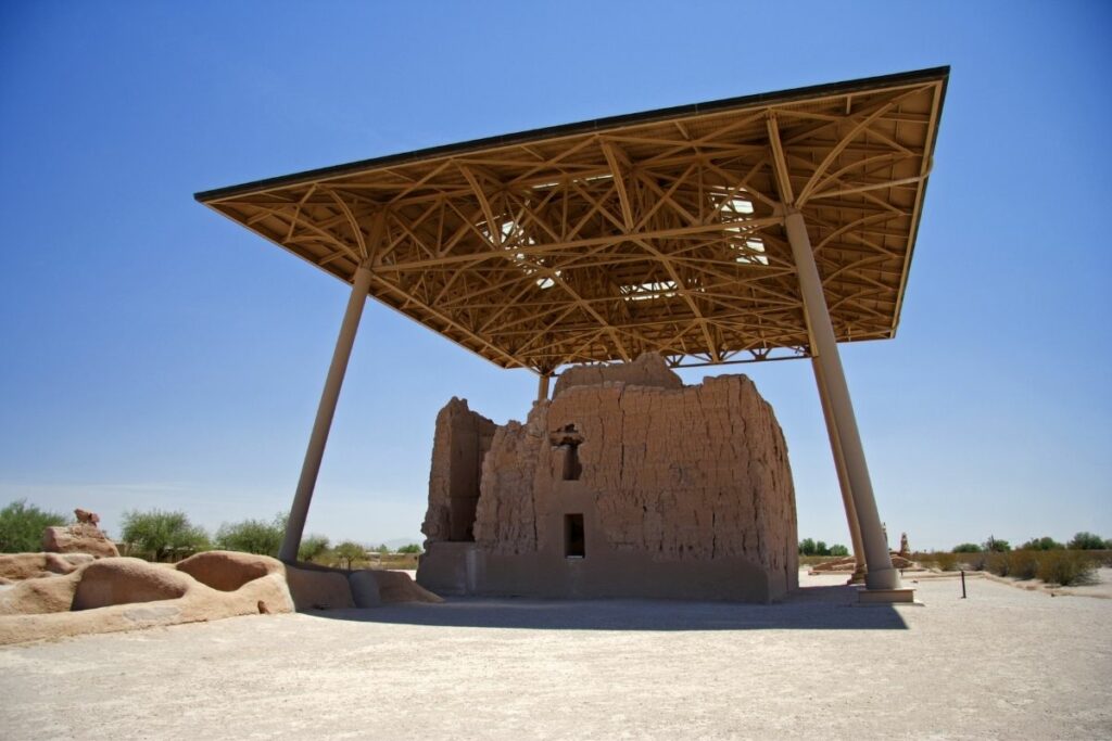 An Ancient Puebloan house protected by a modern shade structure. 