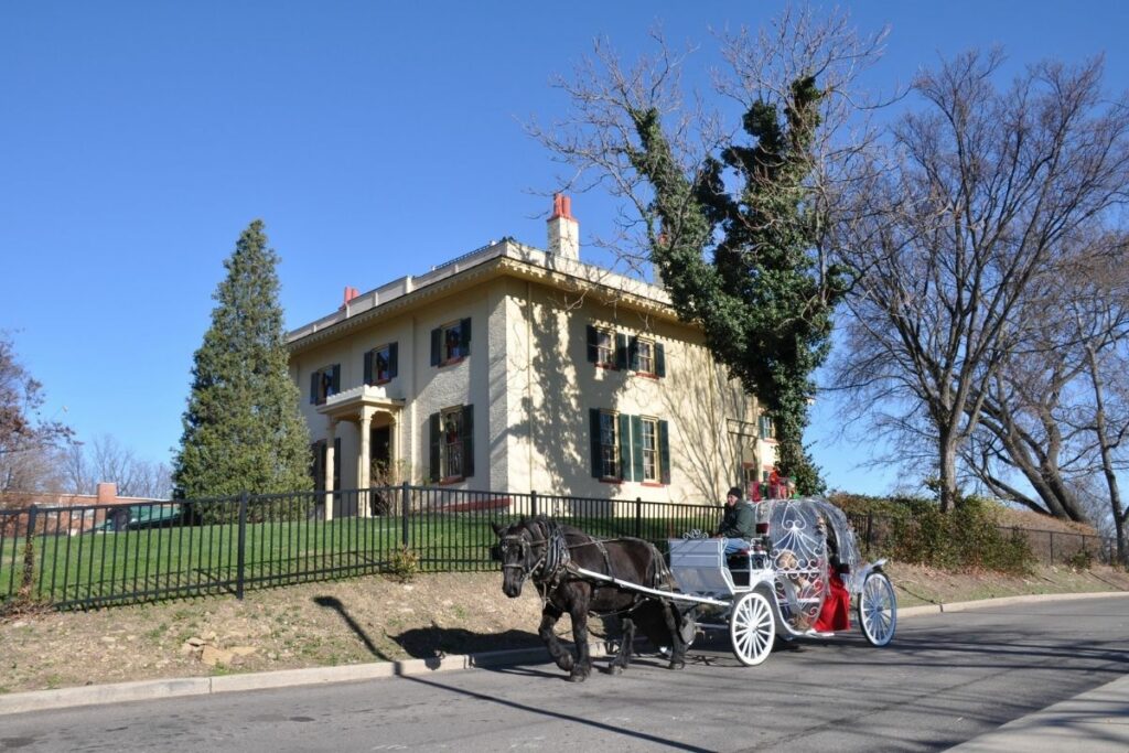A carriage ridding past William Taft's house 