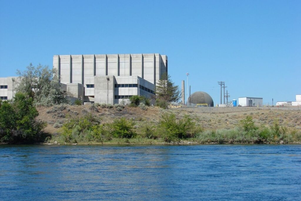 A large concrete building overlooking the river