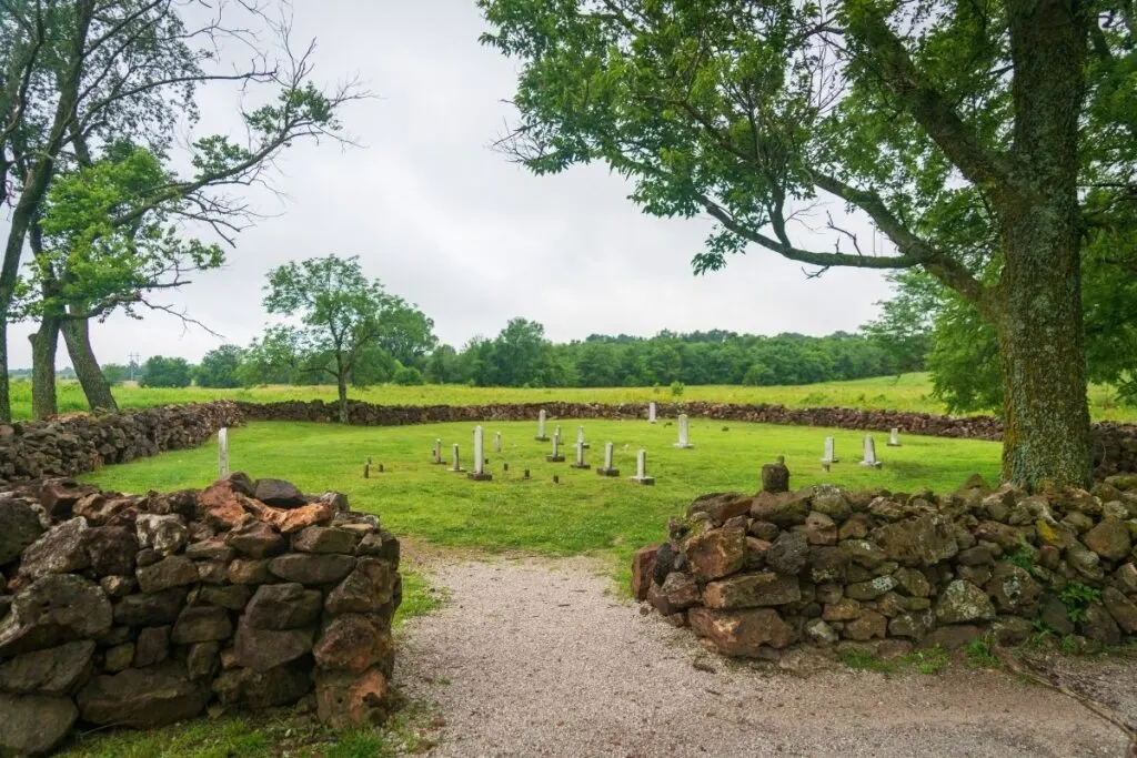 A small cemetery surrounded by a rock wall