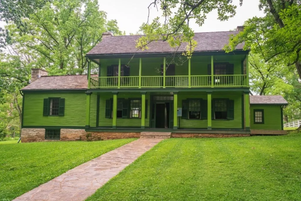 A green two story house