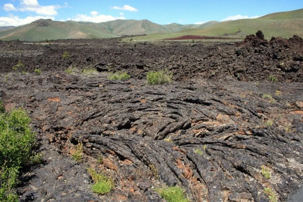 a field of black and orange lava rocks
