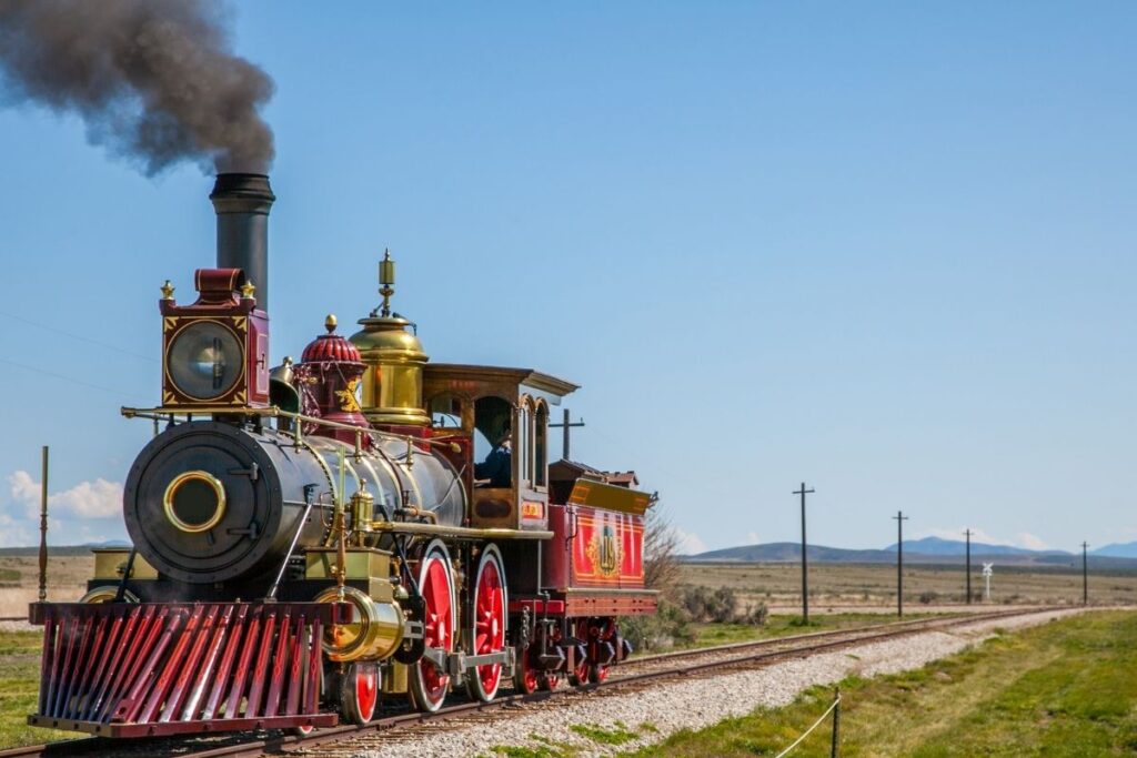 A red and gold locomotive on tracks