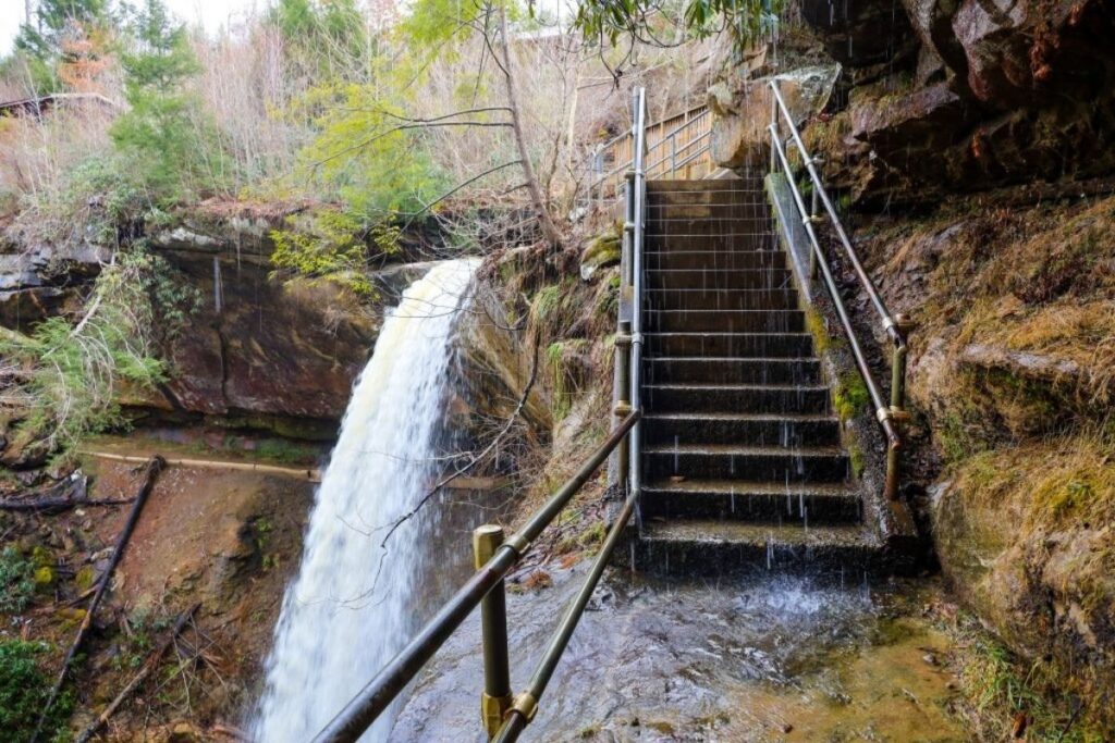 A staircase by a waterfall