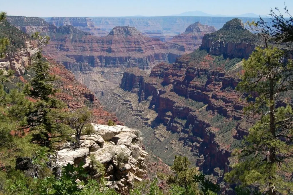 A orange and green view of the grand canyon.