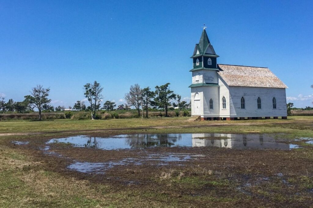 A whitewashed church on a prarie