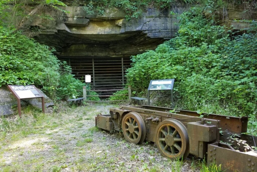 A mine car in front a sealed mine