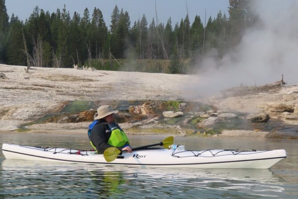a kayaker by a hot spring