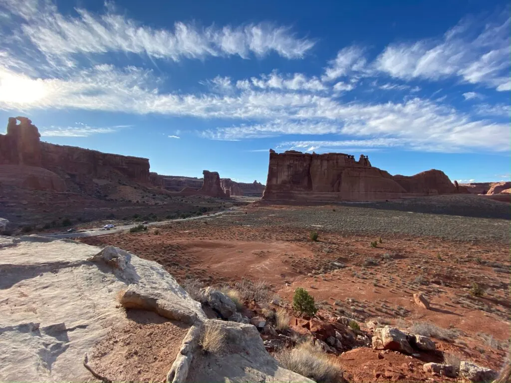 A view of a valley with towering rock formations