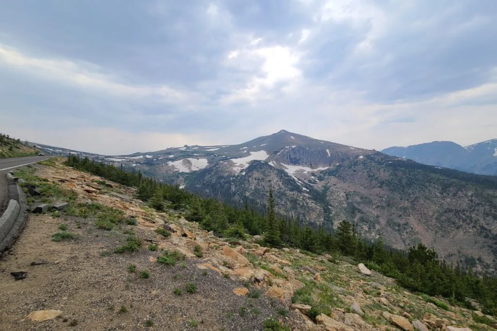 A climbing road leading you to Rocky Mountain National Park.