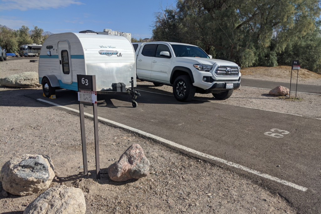 A cozy campsite for a tiny trailer in Death Valley National Park.