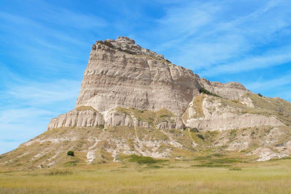 A tall white rocky outcropping in the plains.