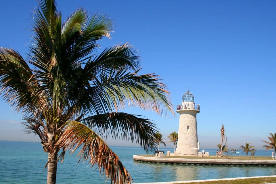 A white lighthouse on the water