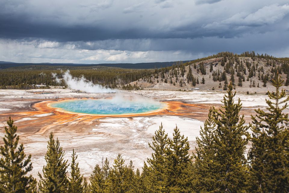 A colorful hot spring in the distance. 
