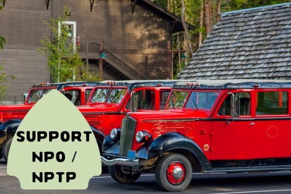 The first image captures a lineup of vintage, red tour buses parked in front of a rustic building with a wooded backdrop. The buses, with their distinctive old-world charm and shiny exteriors, evoke a nostalgic feel, suggesting they may be part of historical or sightseeing tours in a national park.