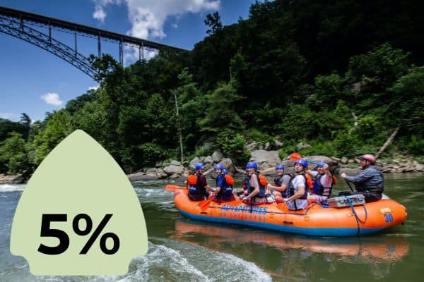 A group of people in an orange raft, rafting under a large bridge with a lush green backdrop. A green icon with "5%" is superimposed on the left side.