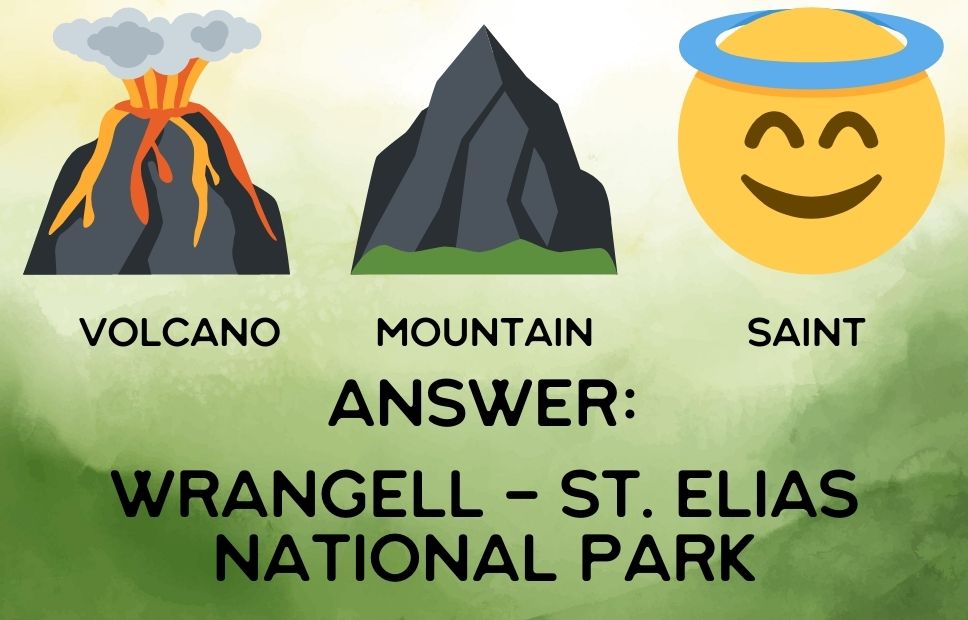 Illustrated riddle showing an erupting volcano labeled "Volcano", a black mountain labeled "Mountain", and a smiling face emoji with a blue halo labeled "Saint". Text below reads: “Answer: Wrangell–St. Elias National Park”.