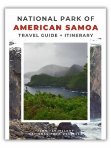 Cover of a travel guide titled “National Park of American Samoa: Travel Guide + Itinerary” by Jennifer Melroy. The central image shows a lush, green coastal landscape with misty mountains in the background and rocky shores in the foreground, showcasing the park’s dramatic and tropical scenery.