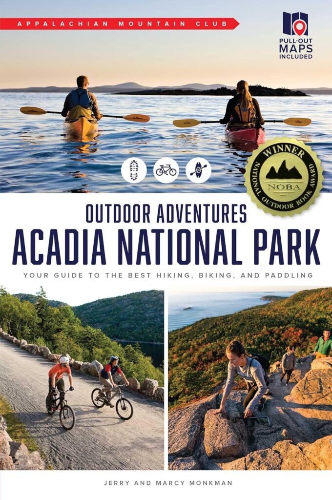 Book cover of "Outdoor Adventures Acadia National Park. Your Guide to the Best Hiking, Biking, and Paddling" by Jerry and Marcy Monkman, published by the Appalachian Mountain Club. Three photographs show two kayakers on calm coastal water, cyclists riding a gravel carriage road, and hikers climbing a rocky mountainside, with badges reading "Pull Out Maps Included" and "Winner National Outdoor Book Award."